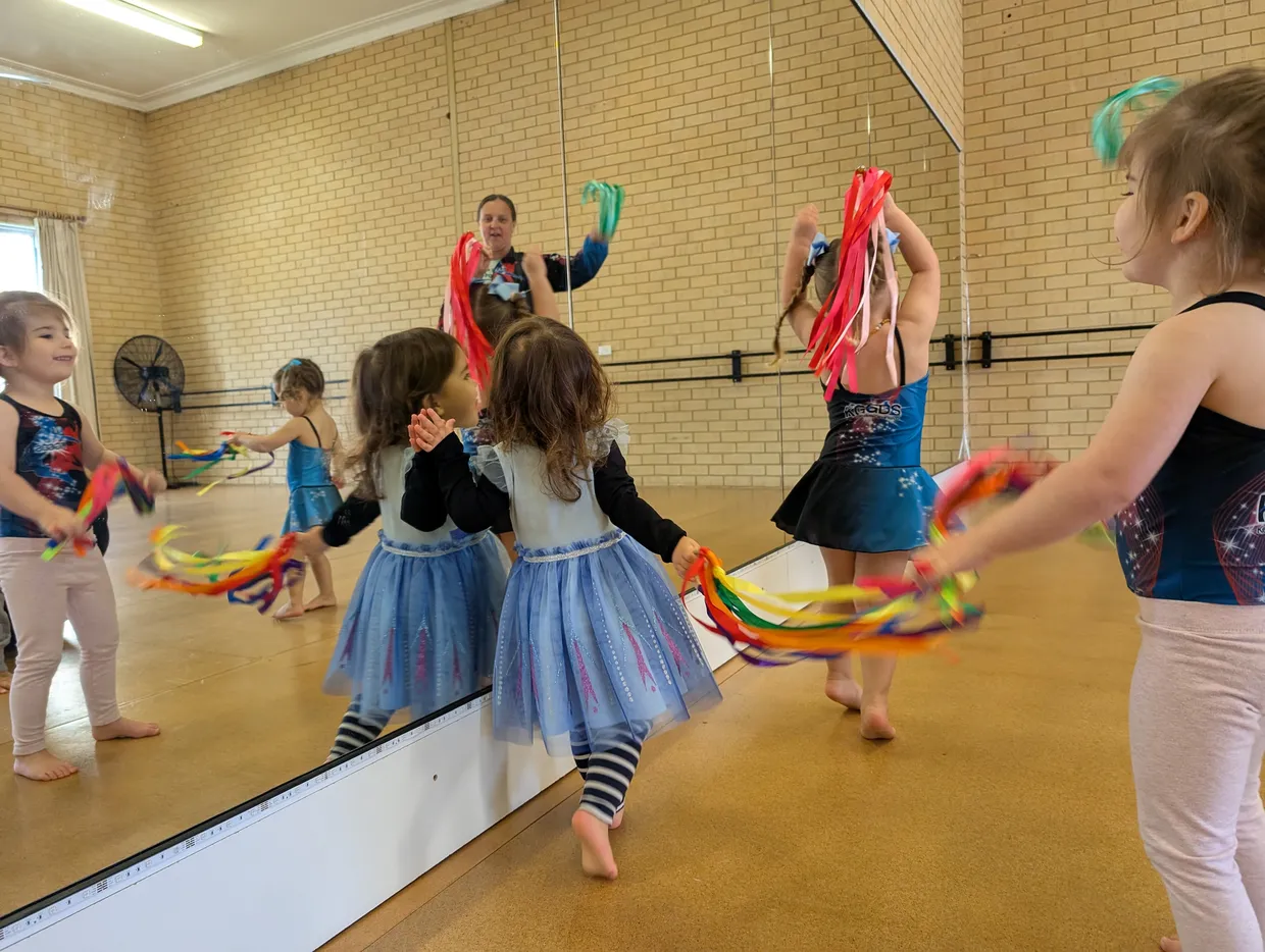 Tiny movers students having fun with streamers.